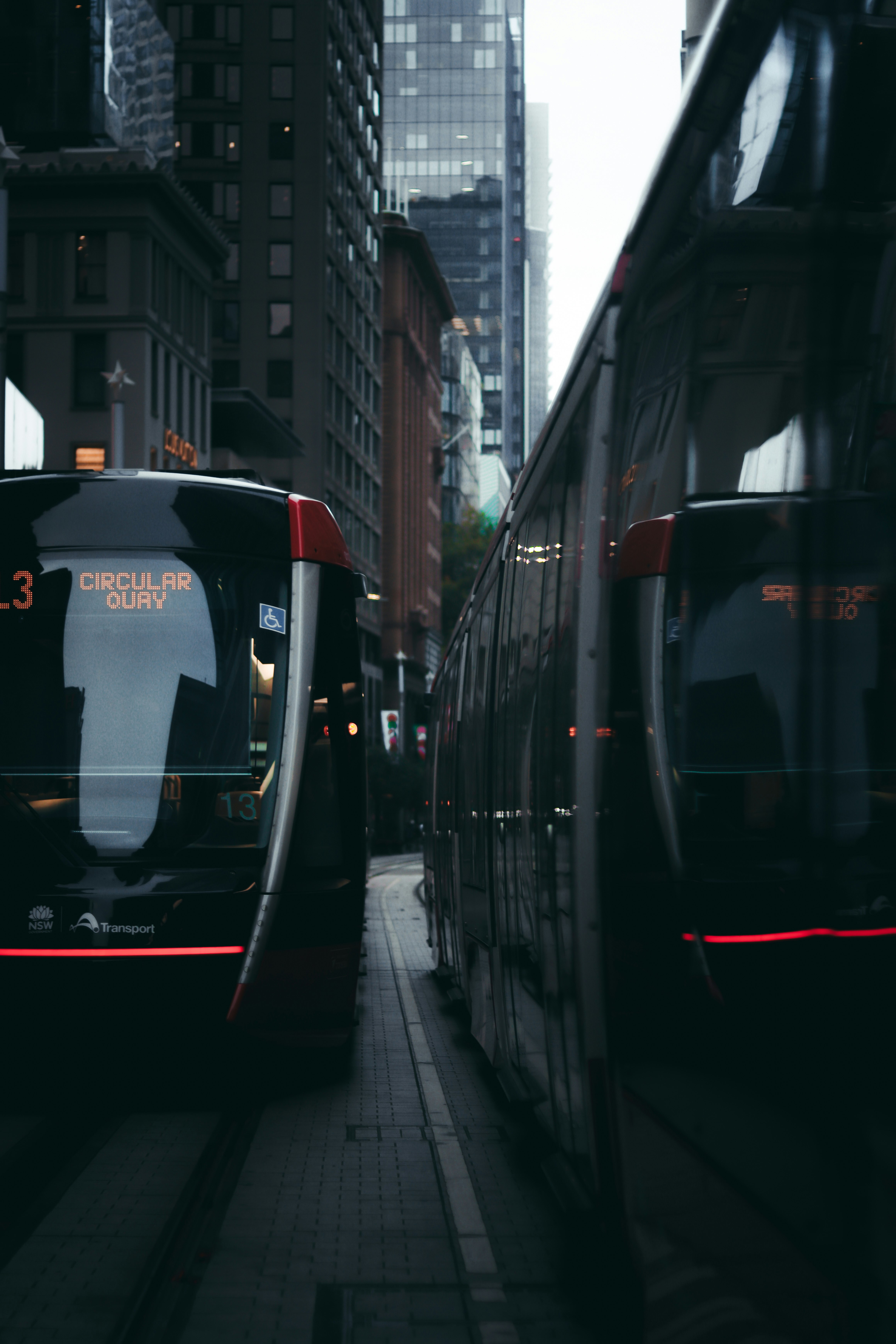 black and red double decker bus on road during daytime